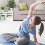 woman-practicing-yoga-at-home-VXZRF8D.jpg